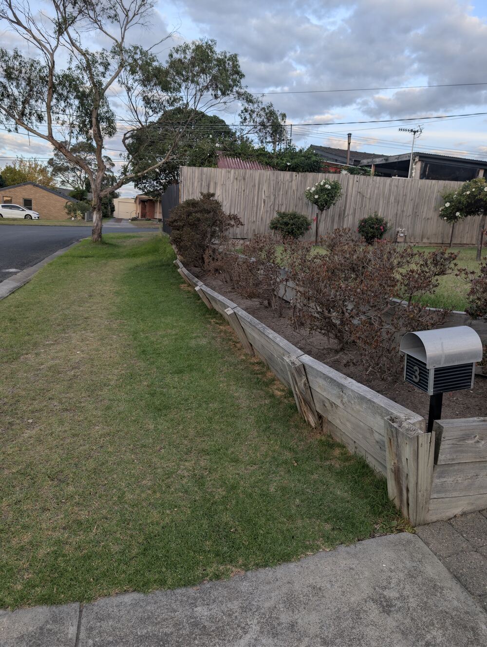 Failed retaining wall leaning